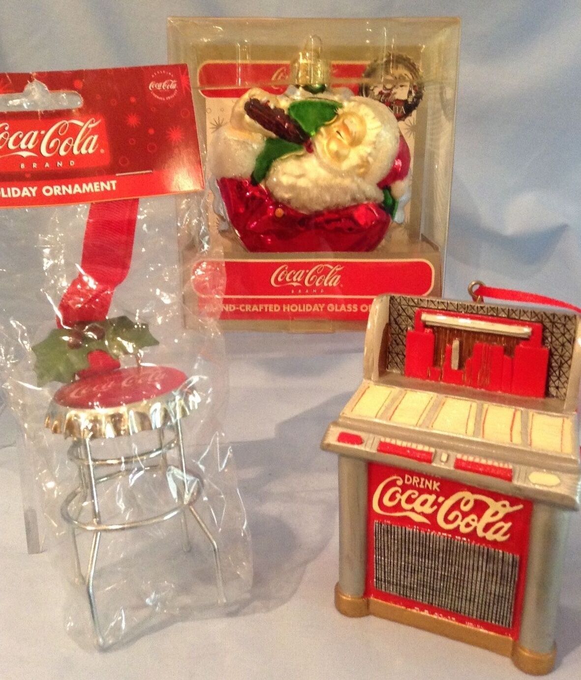 Coca-Cola Ornaments Glass Santa-75th Anniv., Metal Red Jukebox, Stool  Lot/3 $40