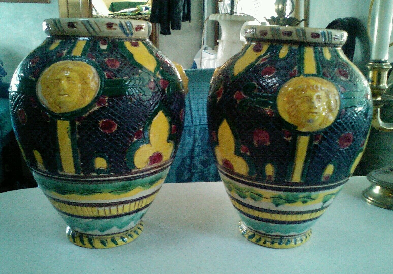 Amazing pair of Early Italian Majolica vases with faces.