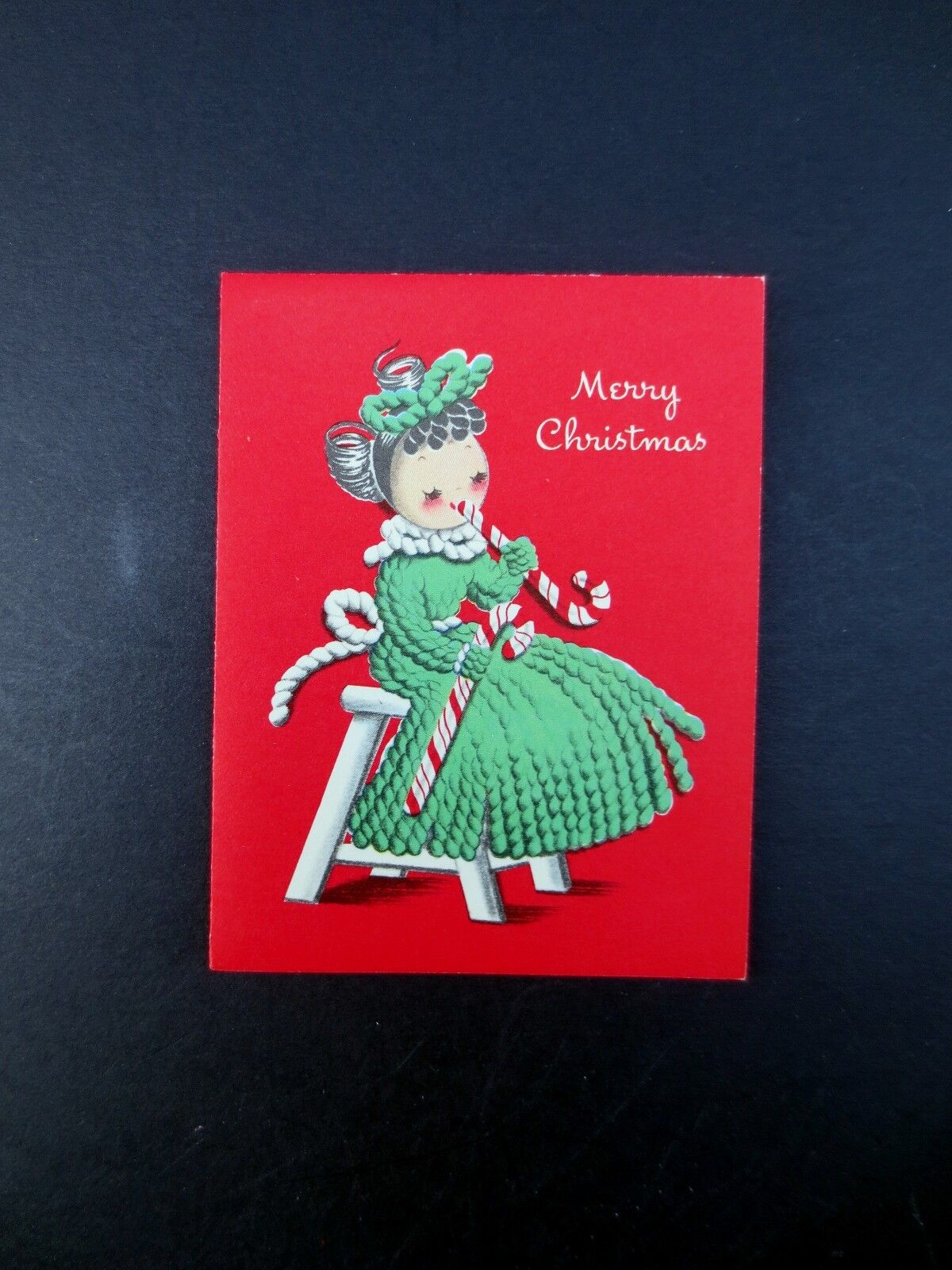 Vintage Unused Xmas Greeting Card Yarn Doll Girl in Green Eating Candy Canes