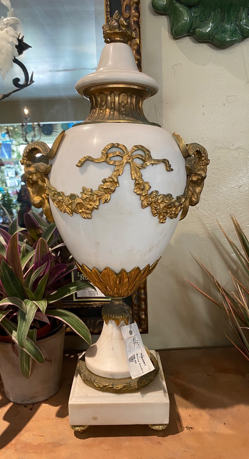 Pair of White marble and bronze footed urns capped with matching finials Pair of White marble and bronze footed urns capped with matching finials