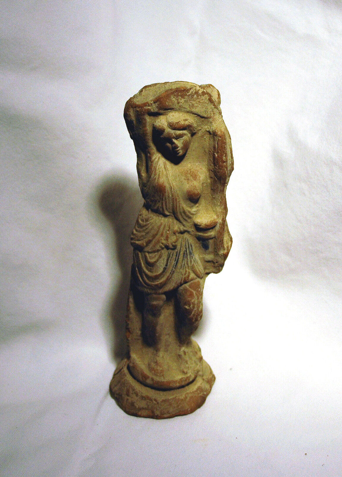Antique statuette of a wounded Amazon