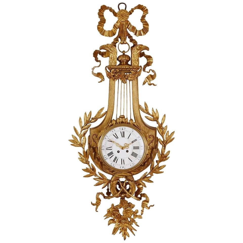 Elegant Neoclassical 19th century Louie XVI style Gilt Bronze Cartel Wall Clock