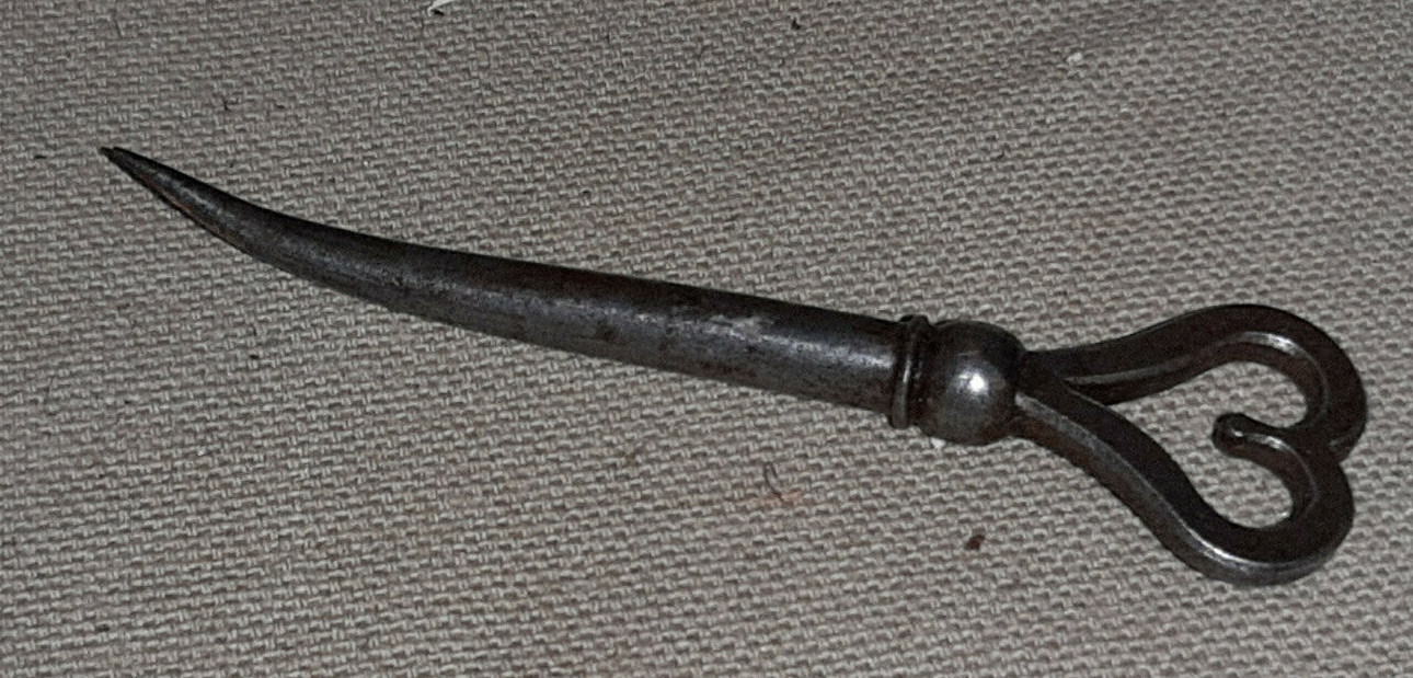wrought iron embroider punch (19th century) decorated with a heart wrought iron embroider punch (19th century) decorated with a heart