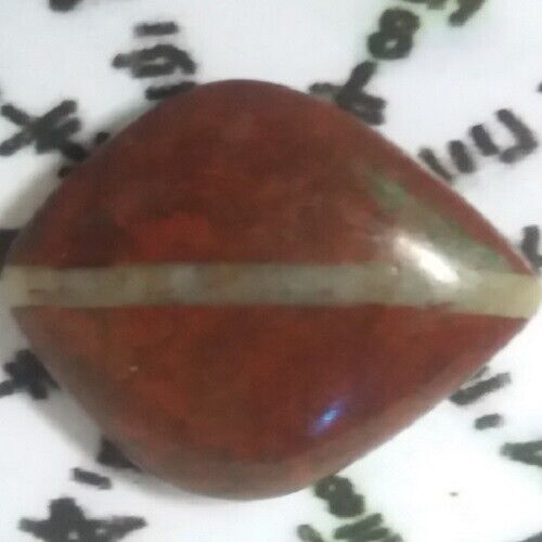red stone amulet yin yang center line from my late uncle also spiritual teacher