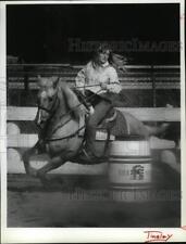 1990 Press Photo Becky Farrington Works Her Horse at Kootenai County Saddle picture