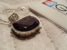 Stunning 50 carat pigeon-blood-red ruby half moon pendant picture