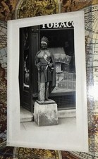BEST RPPC OF CIGAR STORE INDIAN ON EBAY. HE HAS A RIFLE BIG KNIFE 2 MEDALLIONS. picture