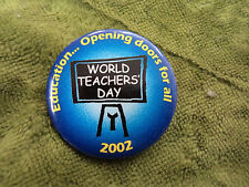 #D290. 2002   WORLD  TEACHERS'  DAY  TIN   BADGE picture