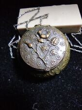 1920's Brass powder compact necklace with original swansdown/celluloid puff picture