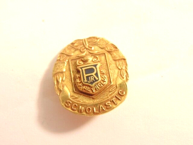 older gold colored J.R. Reynolds High School Scholastic award pin